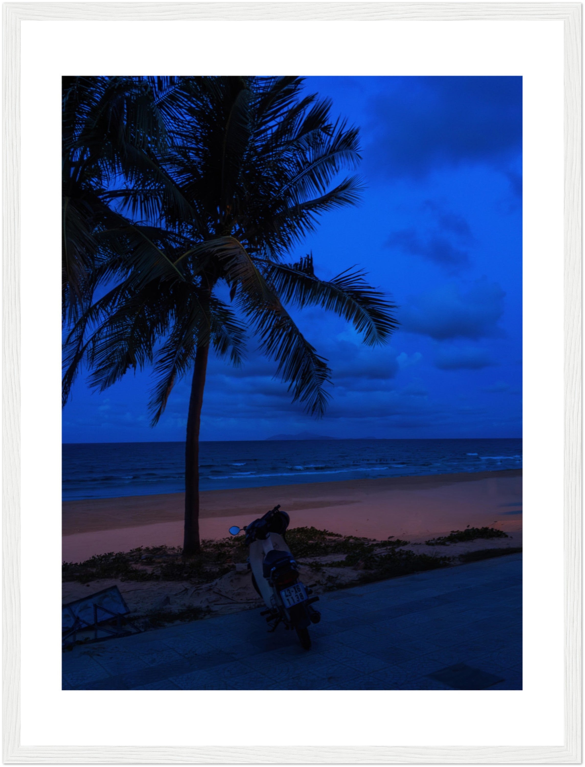 Vietnam's Beach: Motorcycle Rests on Serene Beach | Poster